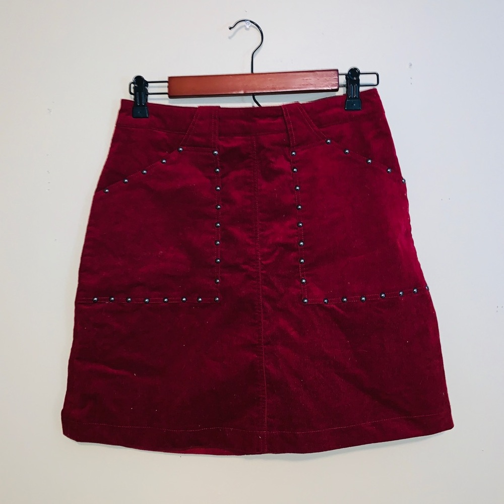 Francesca’s maroon suede mini-skirt